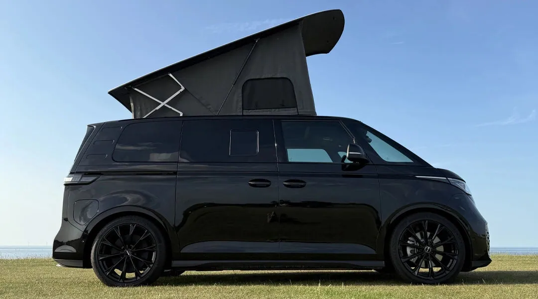 Side view of a VW ID. Buzz with the Horizon roof raised
