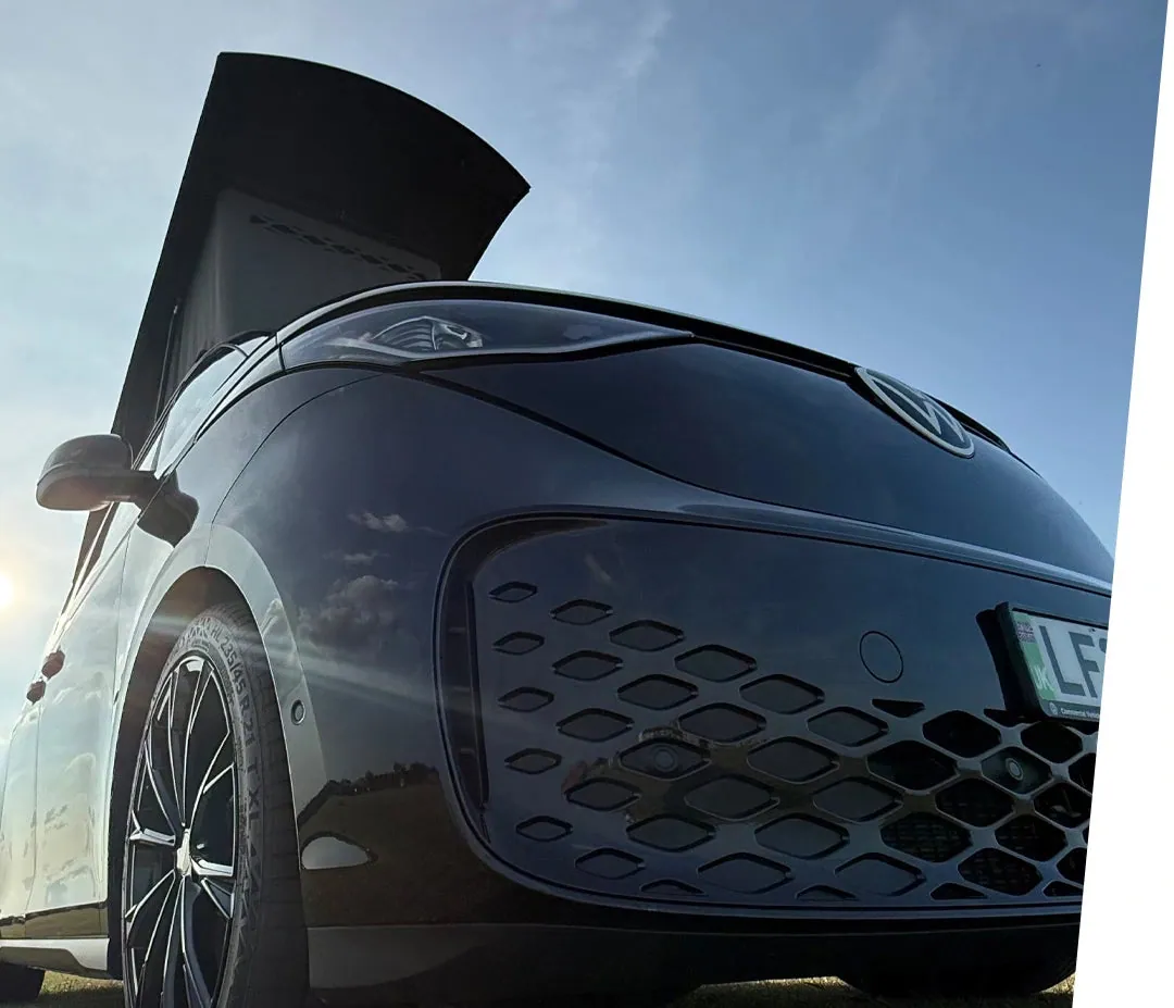 Front of a styled black VW ID. Buzz